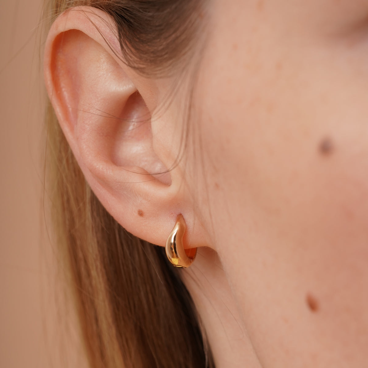 burren jewellery 18k gold plated swirl huggie hoop earring