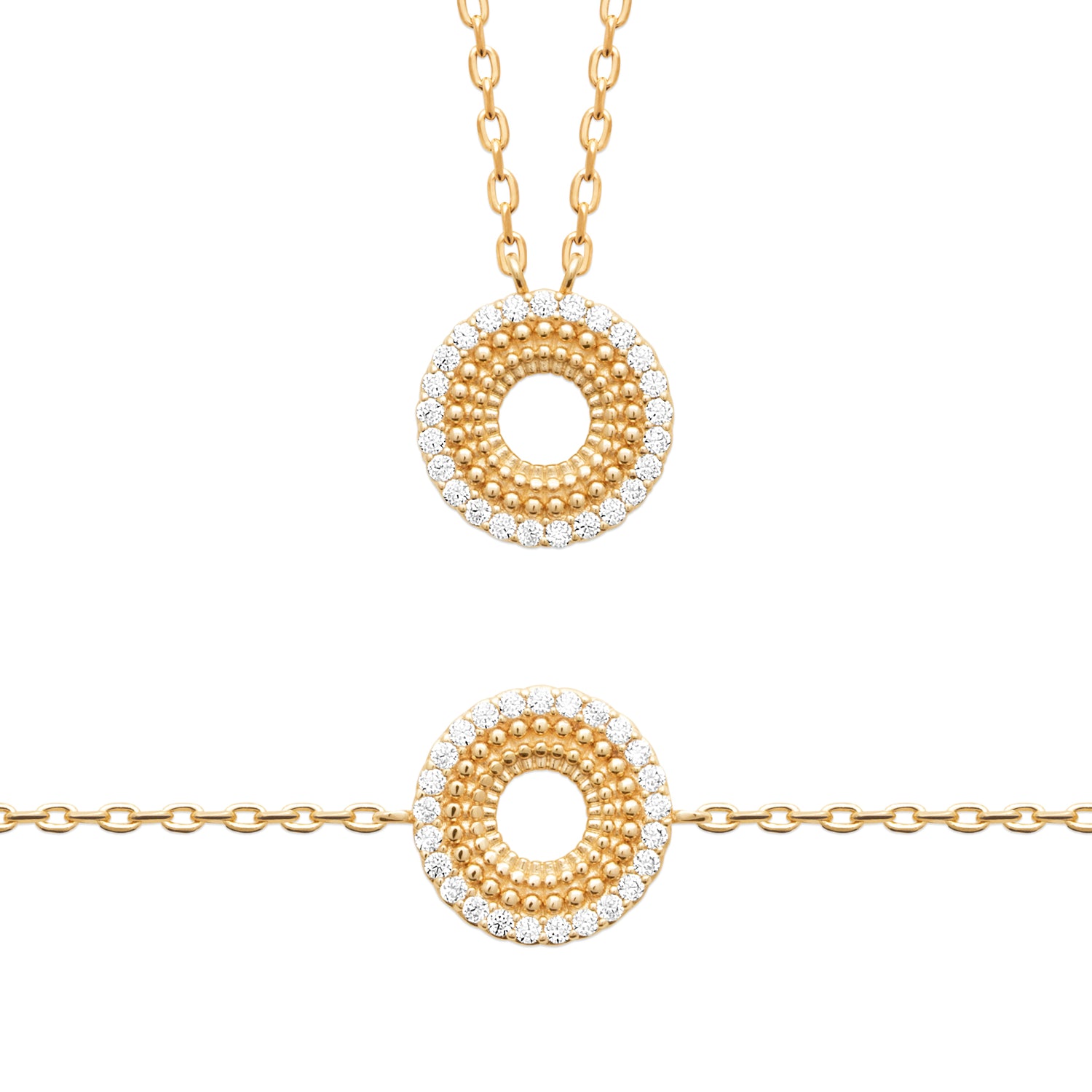 Gold plated necklace and bracelet set on a white background