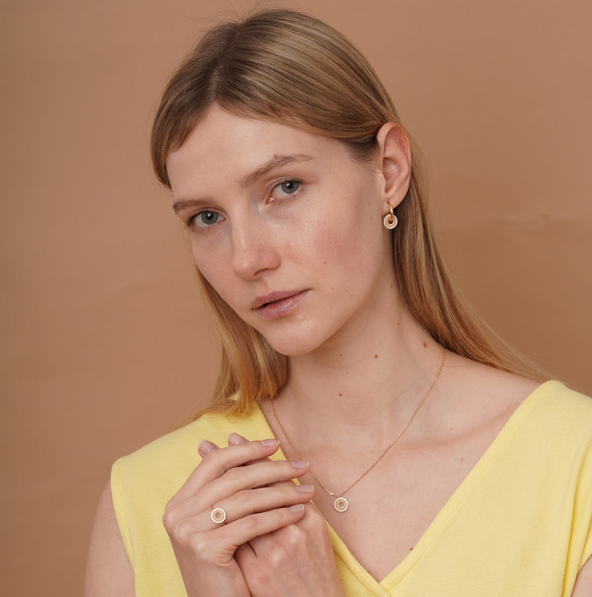 burren jewellery circular earrings with a outer ring of cz stone detailing 