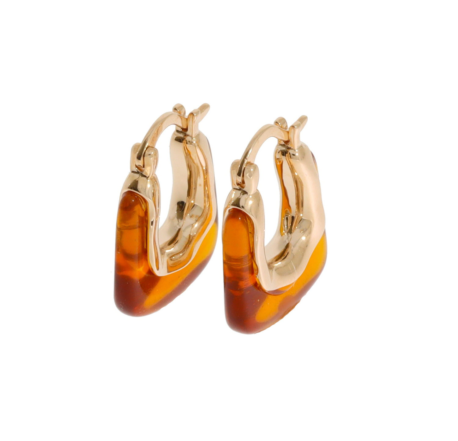 A pair of gold hoop earrings with organic, irregular translucent amber-colored inlays, shown on a plain white background.