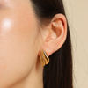 Burren jewellery 18k gold plated Chic Emotion statement wave earrings close up