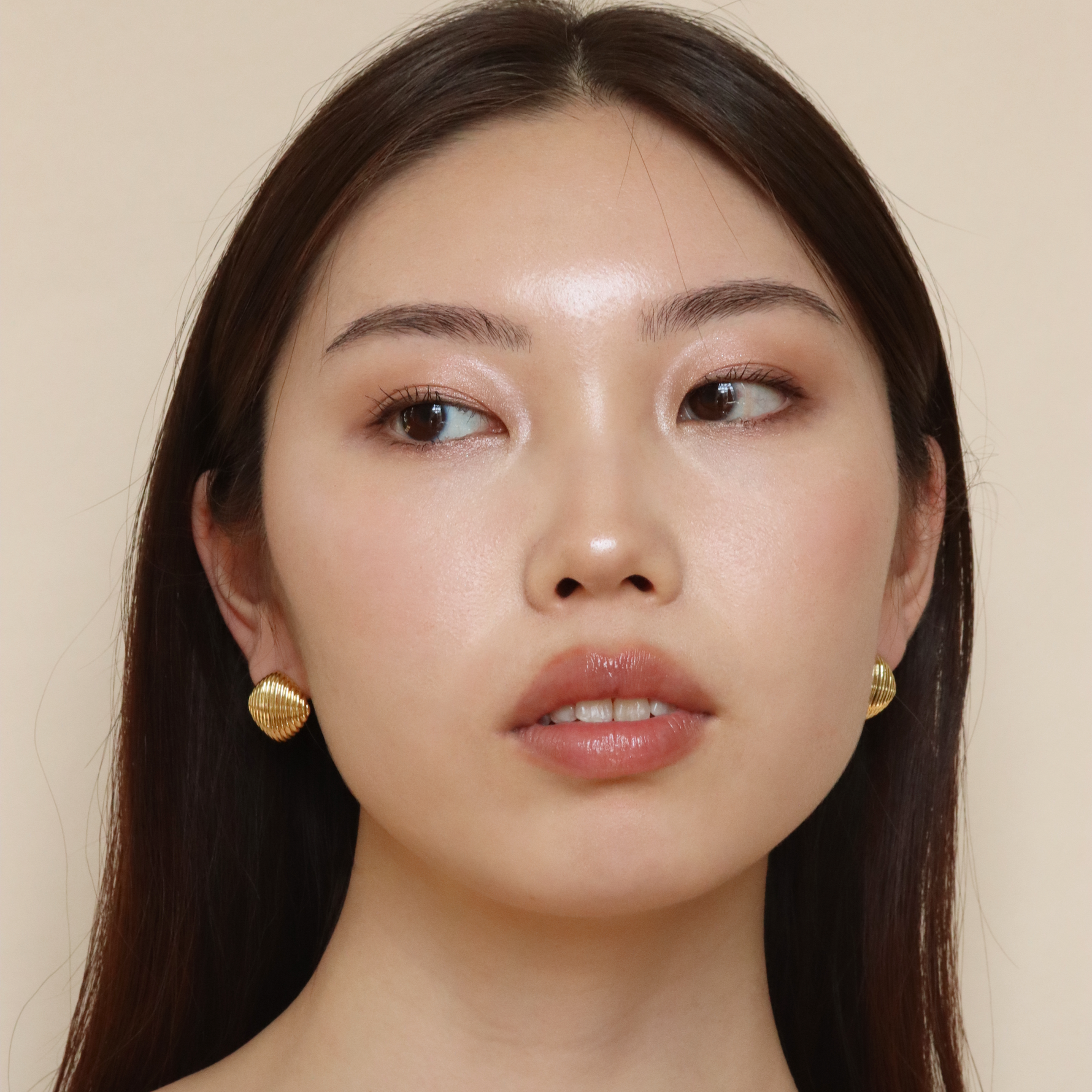 Burren jewellery 18k gold plated Stressed Perfection button dome earring on model