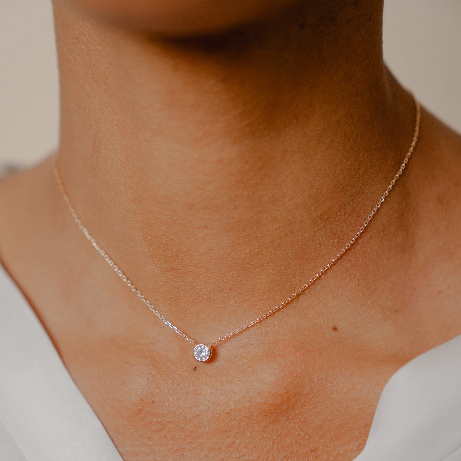 18K gold plate ‘Round About Midnight’ Necklace with centre Cubic Zircon stone in rub over setting