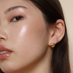 Burren jewellery 18k gold plated small button earrings on model better on saturn