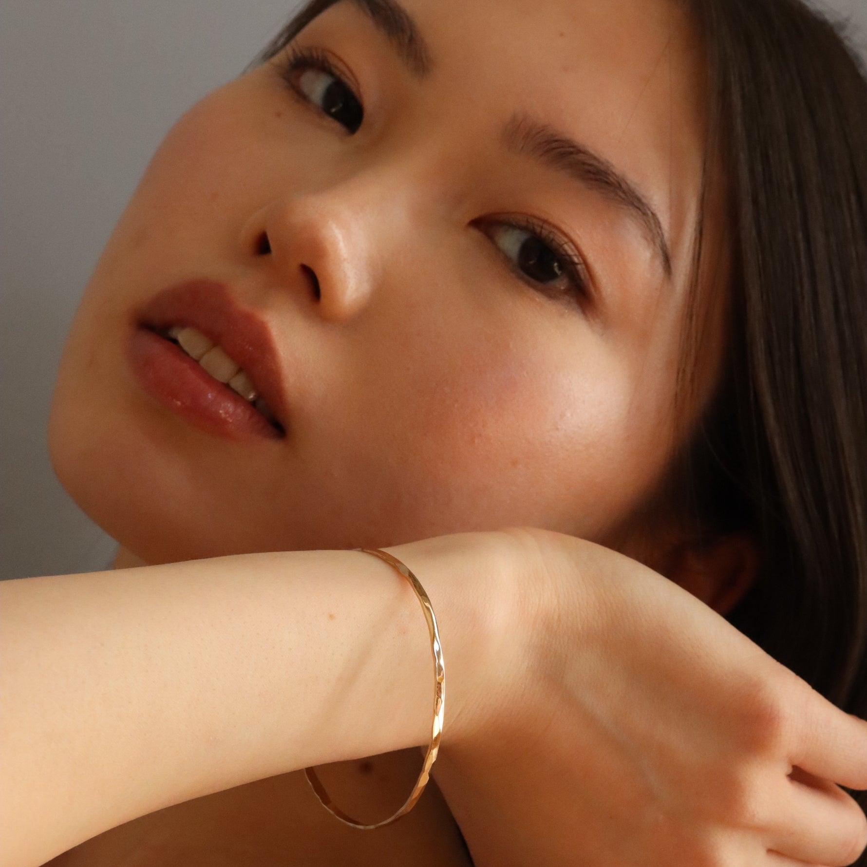 Burren jewellery 18k gold plated stop this train bangle on model