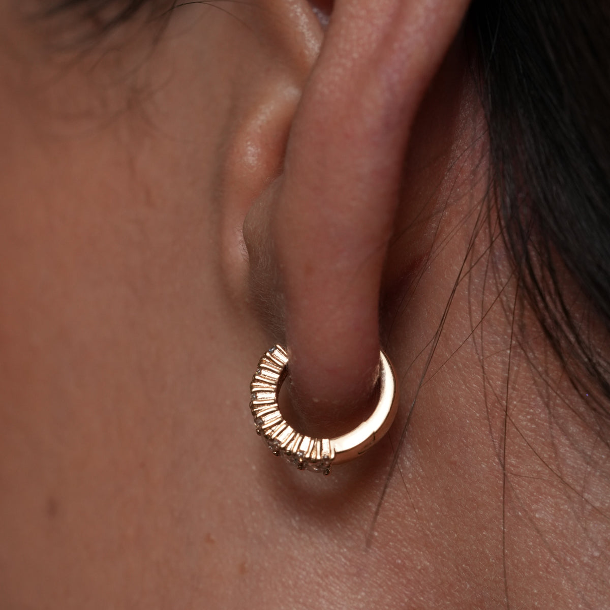 Burren jewellery huggie gold earrings model