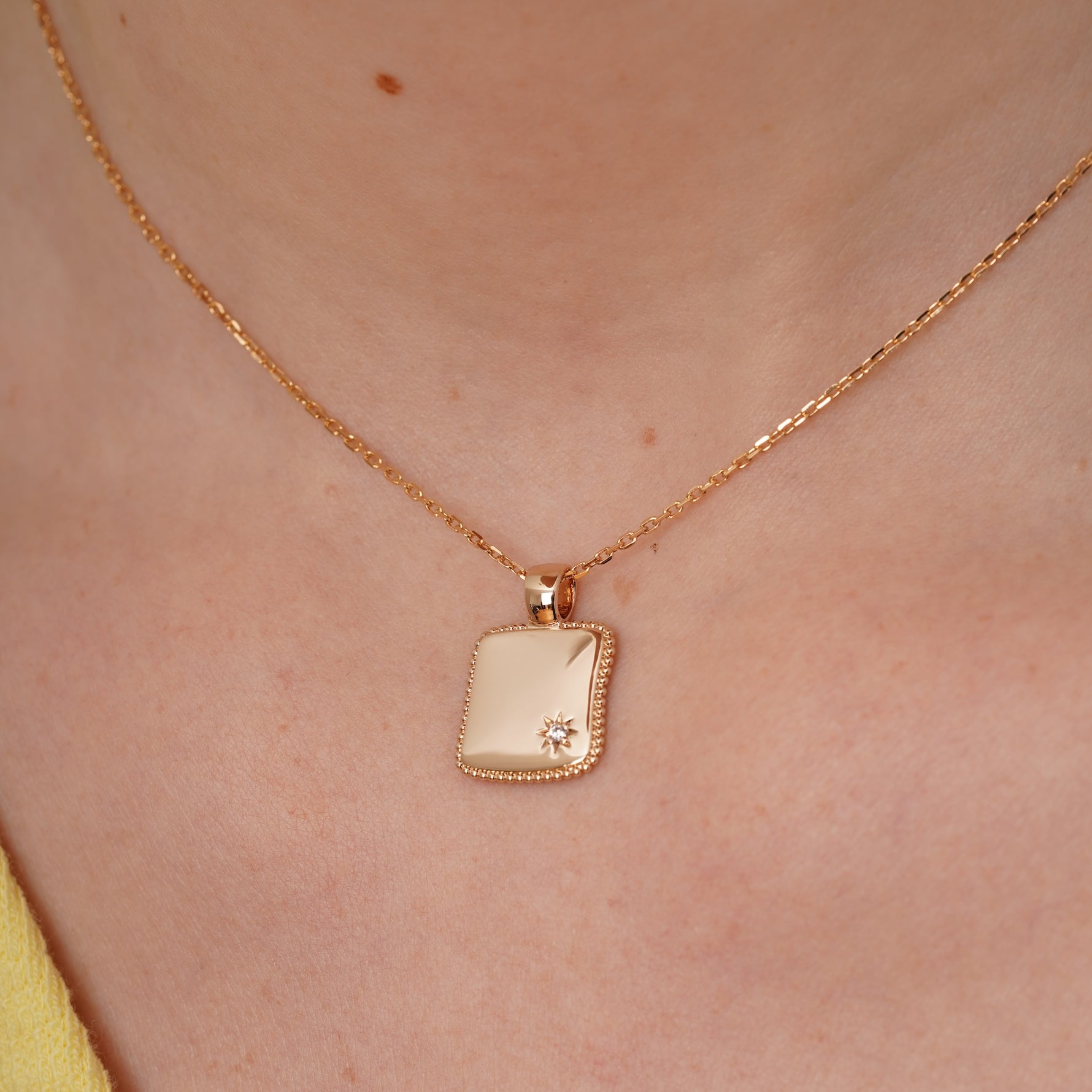 burren jewellery 18k gold plated square disk pendant with cz stone star detail