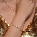 A close-up lifestyle shot of a model's Never Say Goodbye 18K Gold Plated Freshwater Pearl Bracelet and Necklace | Burren Jewellery