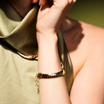 Model wearing Paper Heart Chain 18K Gold Plated Chunky Flat Link Bracelet | Burren Jewellery