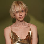 Model wearing the Tidekiss gold plated pearl necklace with matching pearl earrings