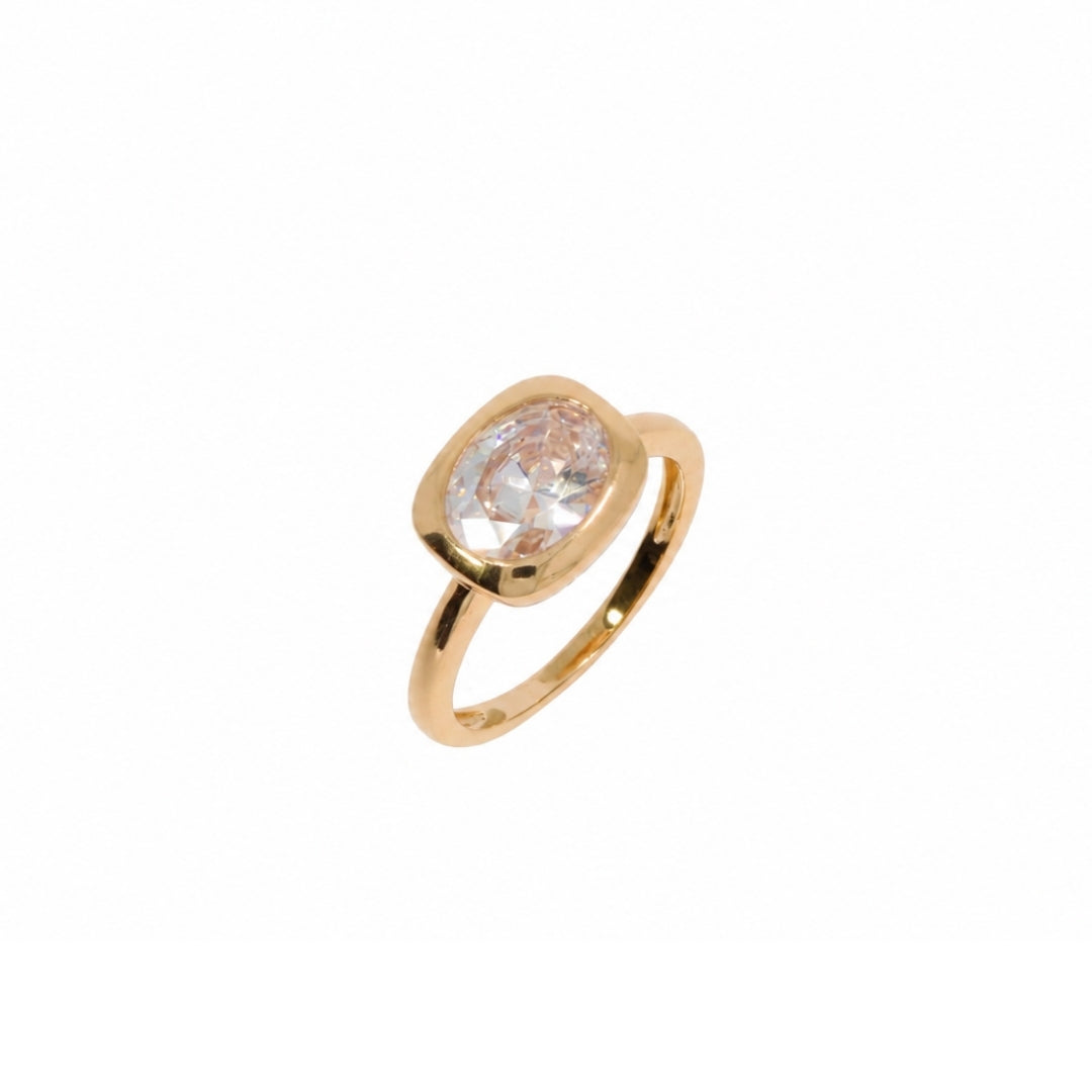 Gold ring with a cubic zirconia on a white background