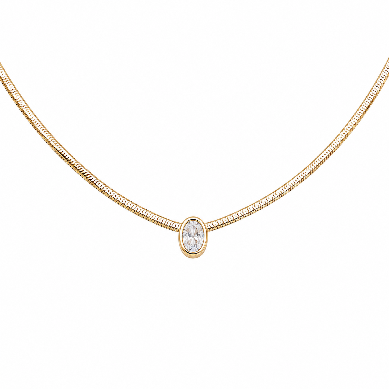 A delicate yellow gold snake chain necklace featuring a single bezel-set oval clear gemstone pendant, shown against a plain white background.