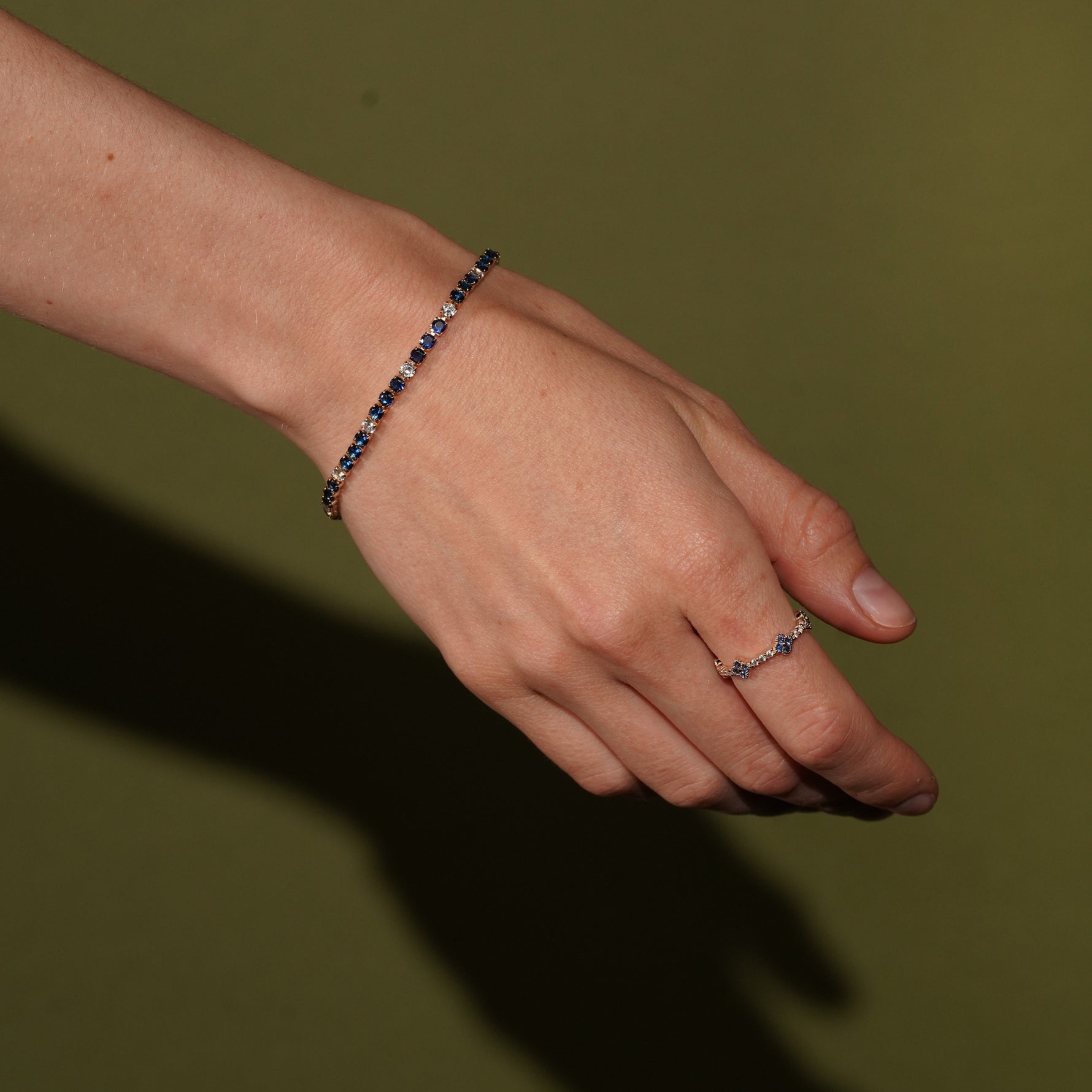 No Apologies tennis bracelet and Tropical Blossom Ring in 18K Gold Plating Featuring Blue Quatrefoil Cubic Zirconia Motifs with White Pavé Cubic Zirconia Accents | Burren Jewellery