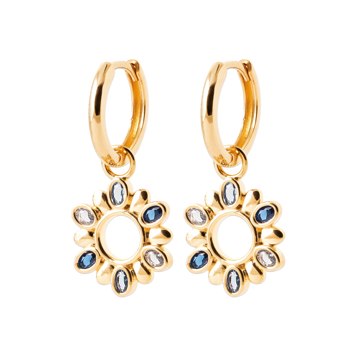 A pair of gold huggie hoop earrings with dangling sunflower charms, embellished with small blue and clear rhinestones, shown on a plain white background.