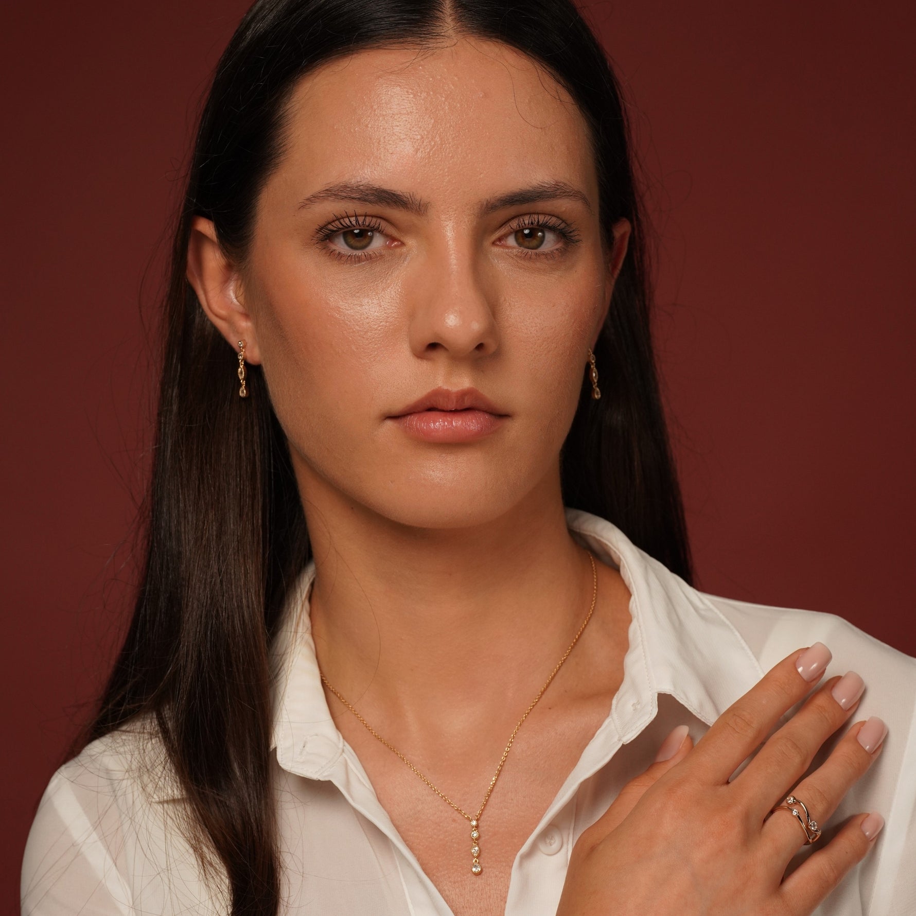 Model wearing burren jewellery 18k gold plated with cubic zirconia 