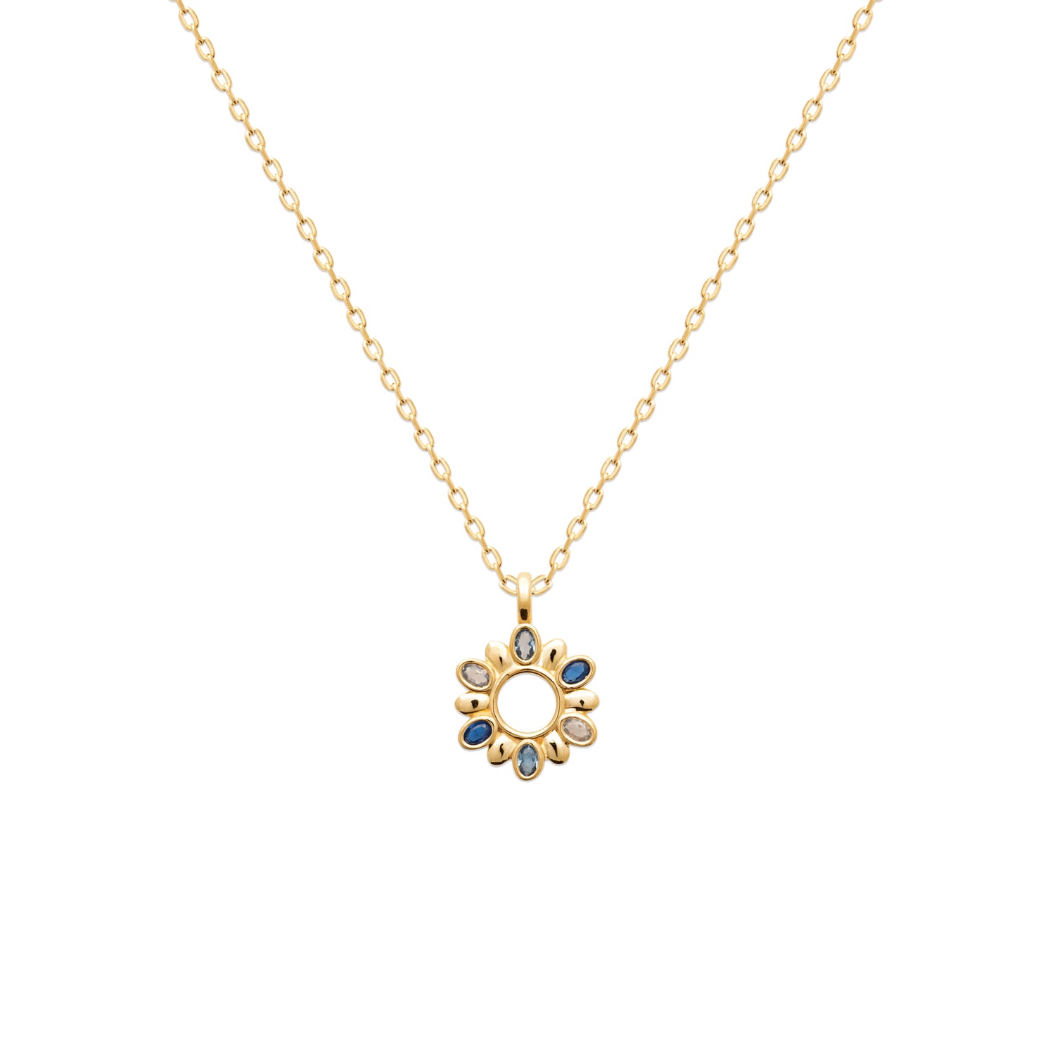 Gold necklace with a circular pendant featuring blue stones on a white background