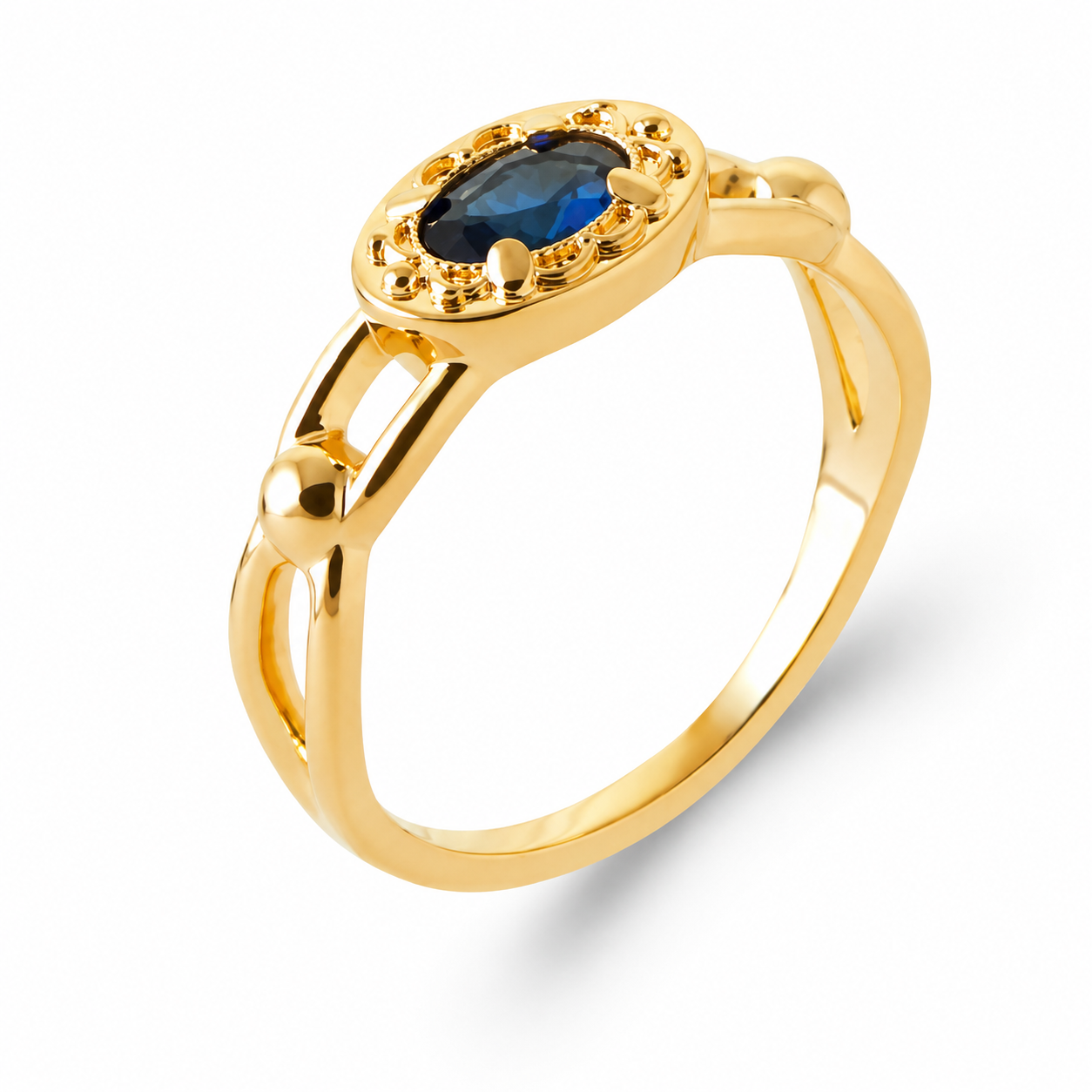 A gold ring with a marquise-cut blue gemstone in an oval setting, surrounded by small gold accents, shown on a clean white background.