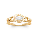 A yellow gold ring featuring an oval-cut clear gemstone in a decorative bezel setting, with a split band design, shown on a plain white background.