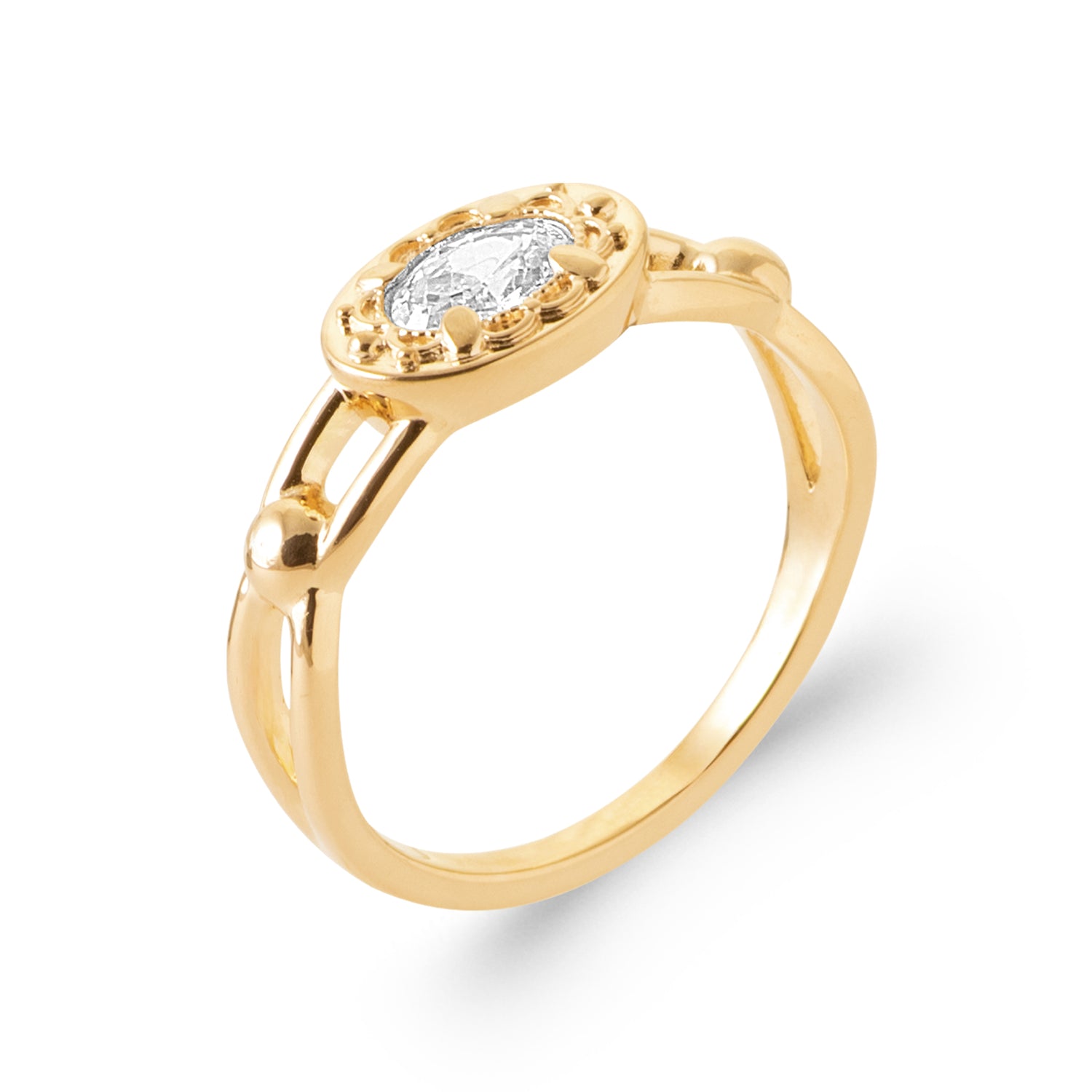 A yellow gold ring with an oval-cut clear gemstone in a beaded halo setting, shown on a clean white background.