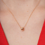 burren jewellery 18k gold plated necklace with a cylindrical pendant 