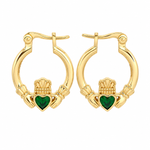 A pair of gold plated hoop earrings with a claddagh heart design, featuring a green heart in the center of each earring, set against a plain white background.