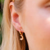 Burren Jewellery 18k gold on the crest huggie earrings model