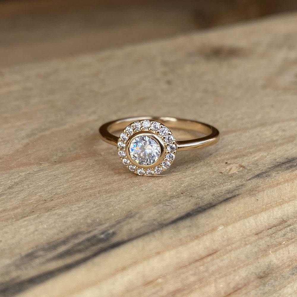 Burren Jewellery 18K gold plate ‘Rising Sun’ ring set with Cubic Zirconia in a cluster style on wood