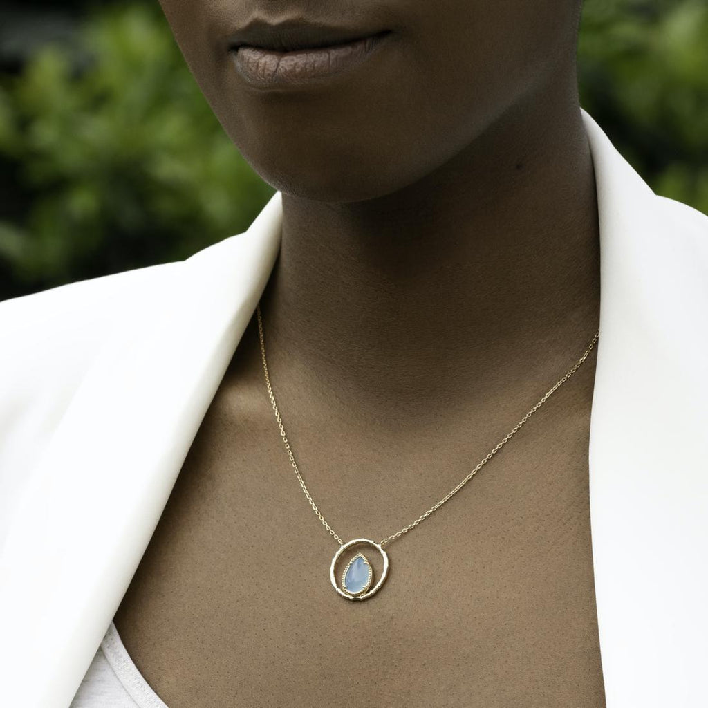 Burren Jewellery The Pair A Yea 18K gold plate necklace with blue agate pear shape stone set on model